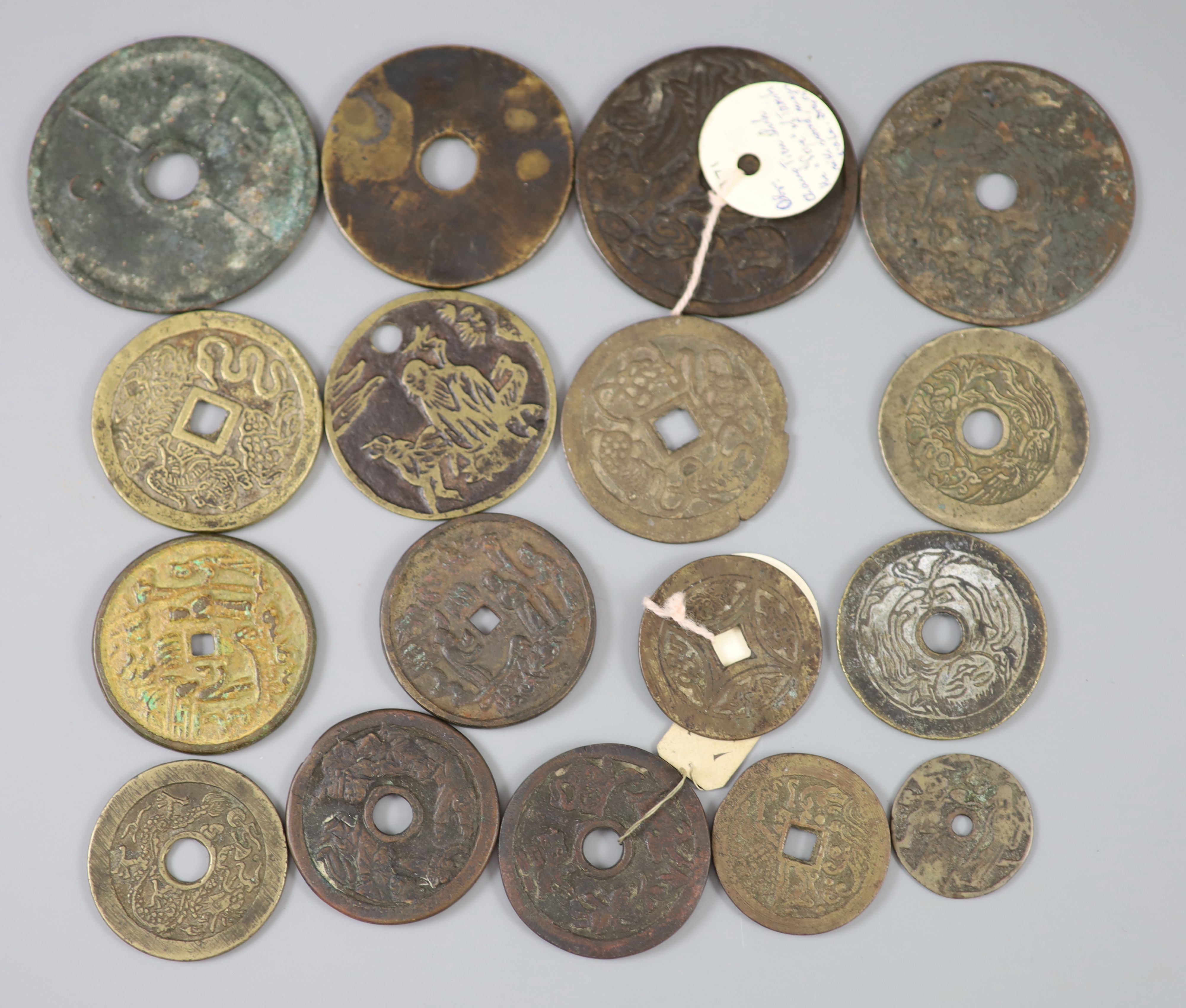 China, 17 bronze or copper charms or amulets, Qing dynasty or earlier,